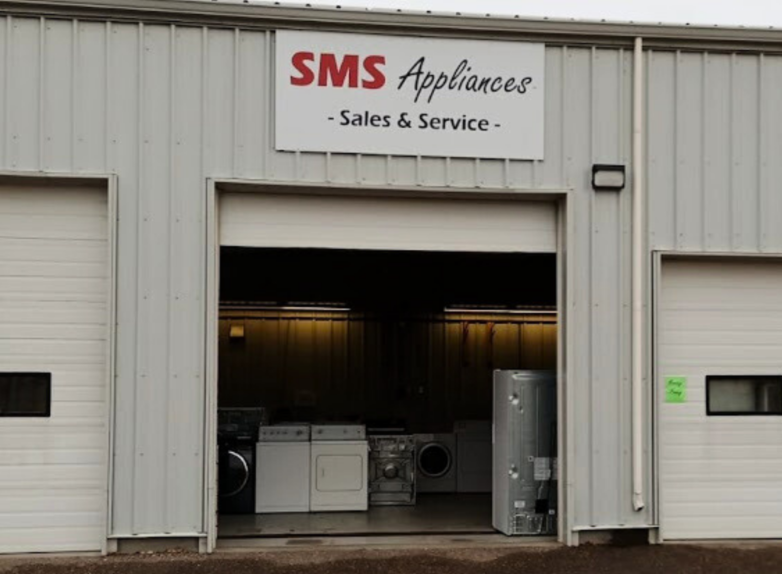 Appliance sale at SMS Appliances Medicine Hat store, featuring new, open box, and refurbished fridges, washers, dryers, and stoves with delivery and installation services.