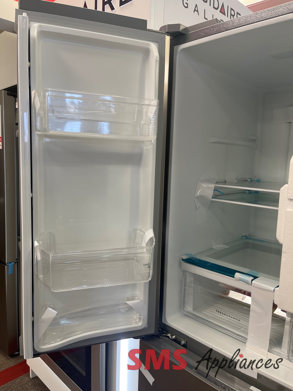 Frigidaire FRQG1721AV open box fridge view - for sale in Calgary