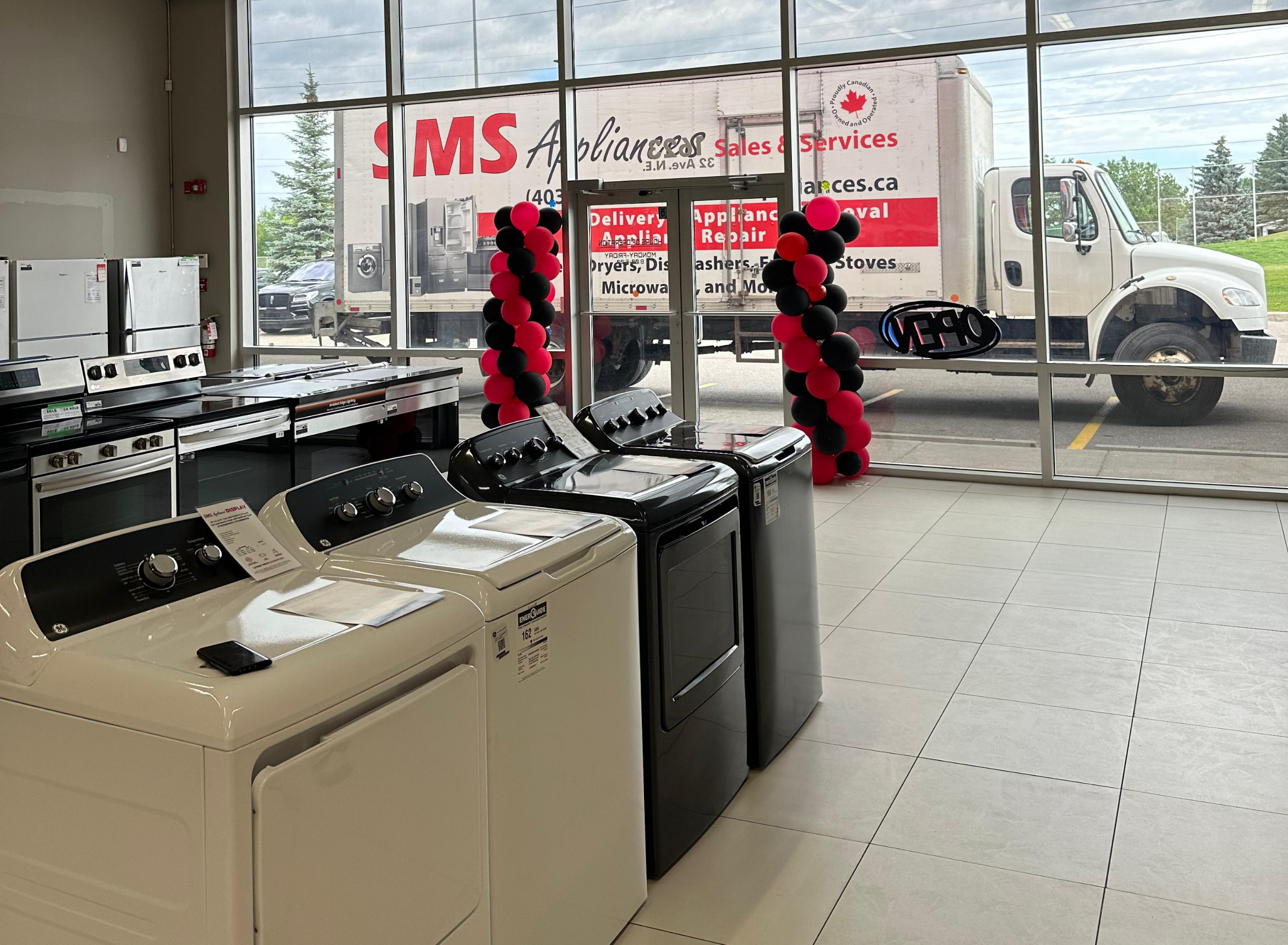 SMS Appliances team providing appliance sales, repair, installation, and delivery services across Calgary, Saskatoon, Regina, Okotoks, Medicine Hat, and Airdrie. 