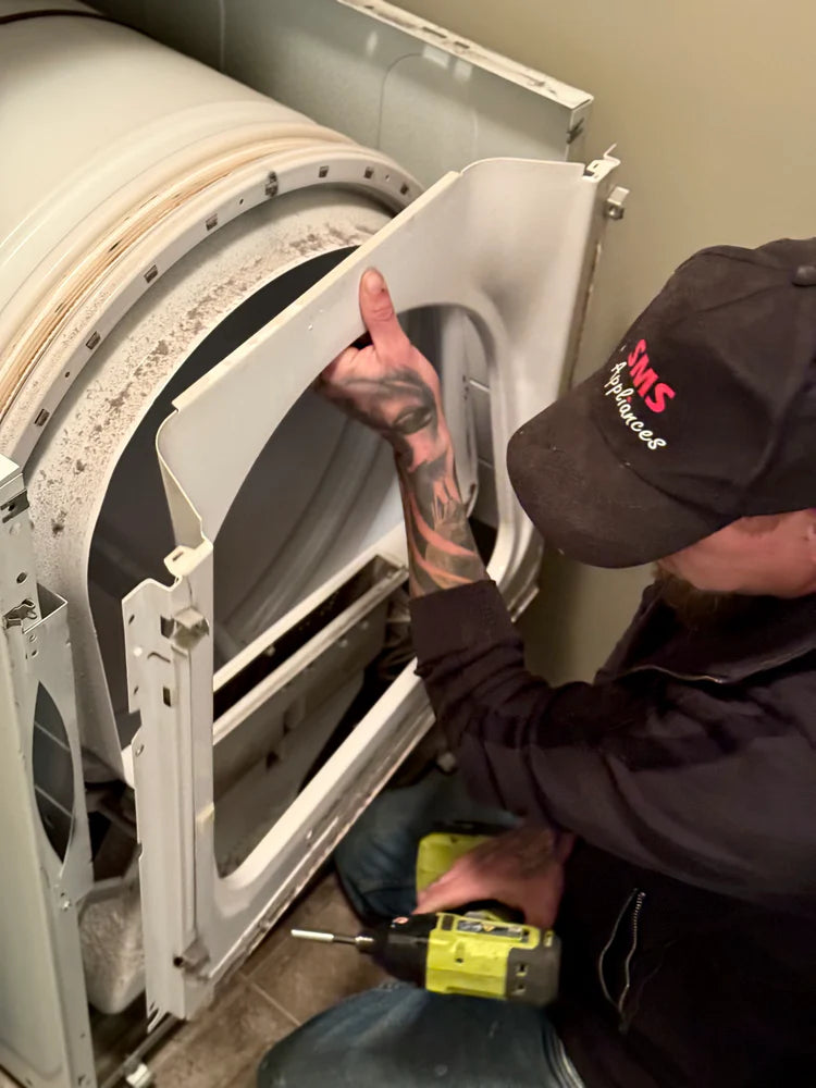 Appliance maintenance services in Regina by SMS Appliances technician performing routine inspection and servicing of home appliances for reliable performance