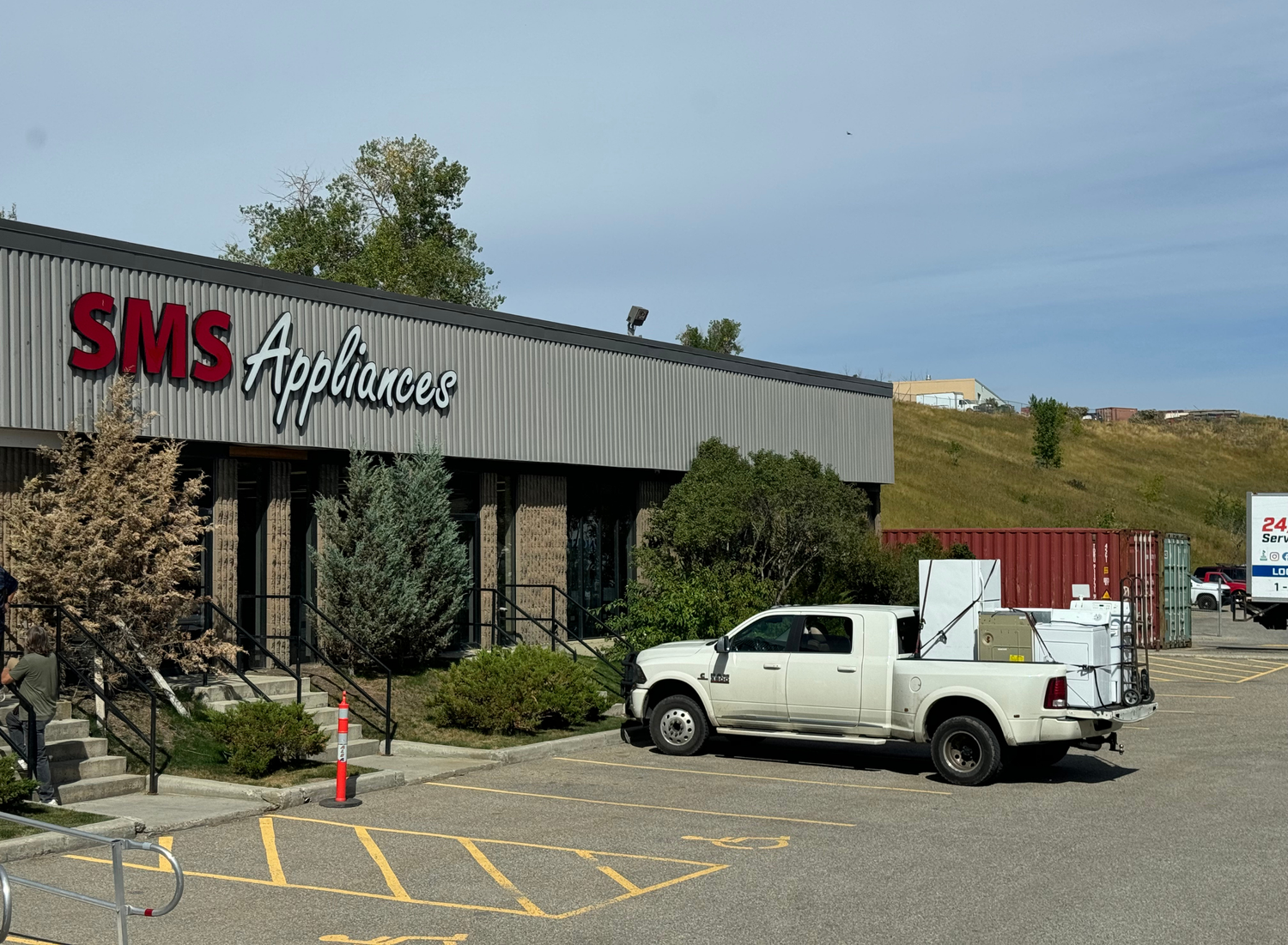 Appliance removal and haul-away services by SMS Appliances Calgary South, safely disposing of old fridges, washers, dryers, and stoves.  