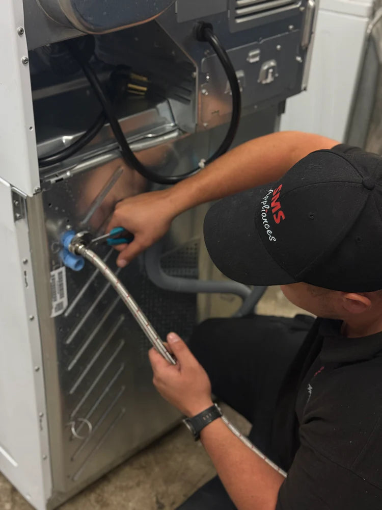 Expert washer installation services in Regina by SMS Appliances technician installing a new washing machine safely and professionally