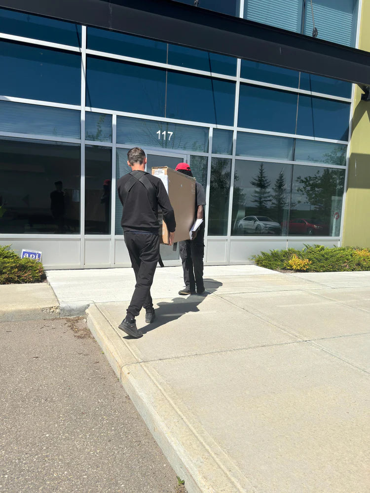 Professional cooktop delivery and logistics services in Regina by SMS Appliances team delivering a cooktop safely and securely to a customer home